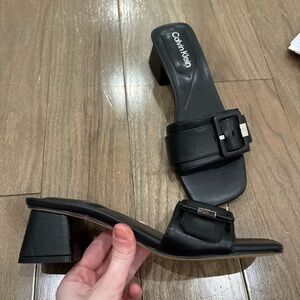 Black Calvin Klein kitten heels! Some scratches on the back of the heel.